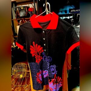 Black Polo Shirt with Red Collar and Floral Design